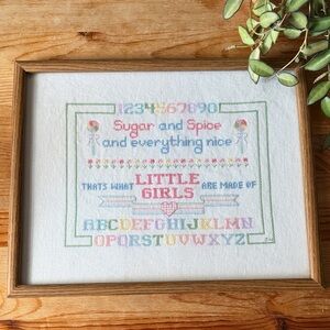 Vintage Little Girl Cross-Stitch Art with Colorful Alphabet
